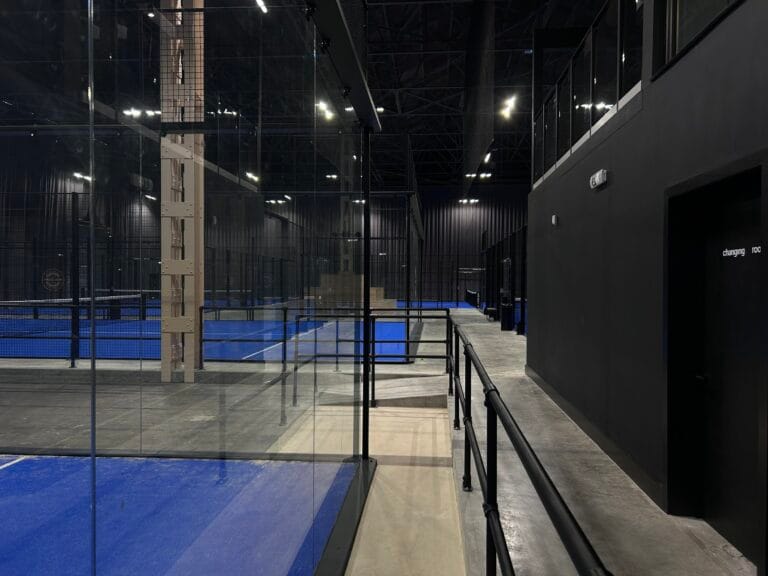 Padel Box Bermondsey – indoor padel courts with black walls at a modern urban facility in South London