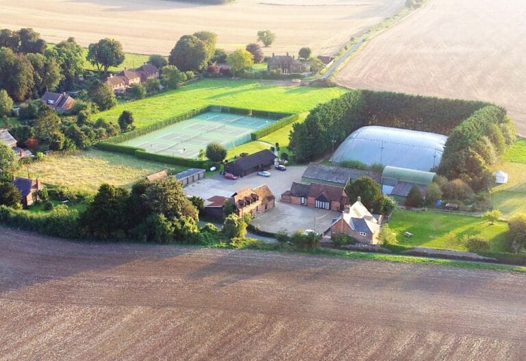 Manydown Tennis, Padel and Pickleball Club – side view of outdoor courts showcasing tennis, padel, and pickleball facilities in a modern club setting