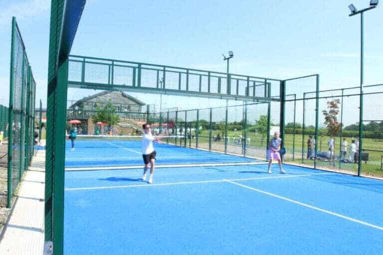 Outdoor courts at Marden Cricket & Hockey Club with people playing and spectators watching, highlighting the club’s lively sporting atmosphere and community engagement in Kent.