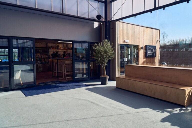 The Padel Club Trafford City - showing the main entrance to the padel club, featuring modern architecture and branding, welcoming players to a premier padel facility in Greater Manchester.