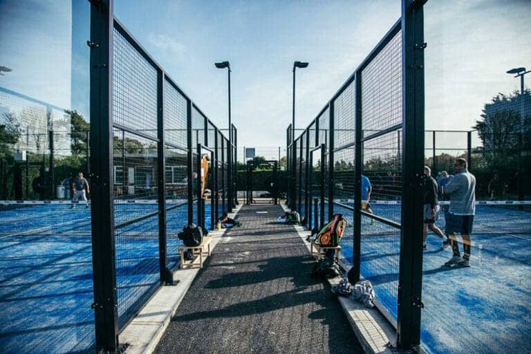 UK PADEL @ Holmer Green Padel Image 1 showing outdoor padel courts with players actively engaged in matches, highlighting the club’s vibrant community and quality facilities in Holmer Green, Buckinghamshire.