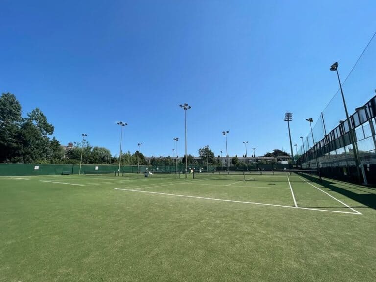 Outdoor tennis courts at Bective Tennis & Padel Club in Donnybrook, Dublin, with professional surfaces and floodlights for all-weather play.