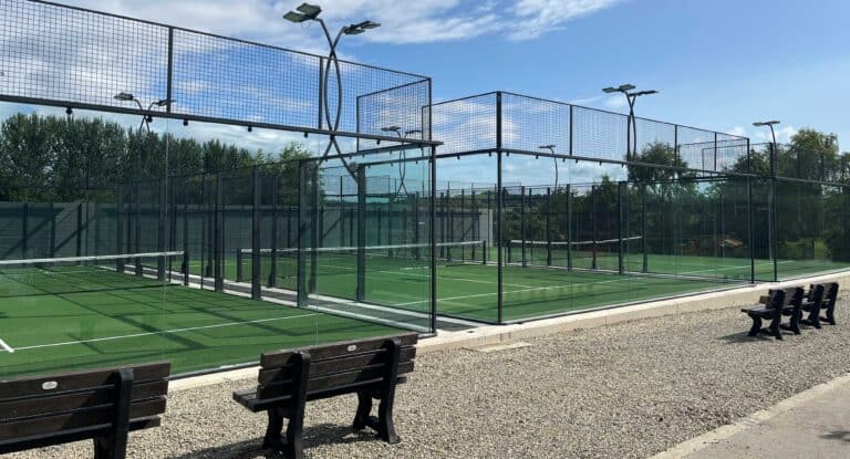 A scenic view of River Valley Holiday Park in County Wicklow, Ireland, featuring lush green surroundings, family-friendly accommodations, and outdoor activity areas including padel courts, playgrounds, and open camping spaces—ideal for relaxing, playing, and exploring nature.